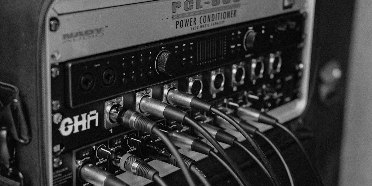 GoatHead Audio mobile rack with power conditioner, preamps, and XLR cables connected for on-location recording