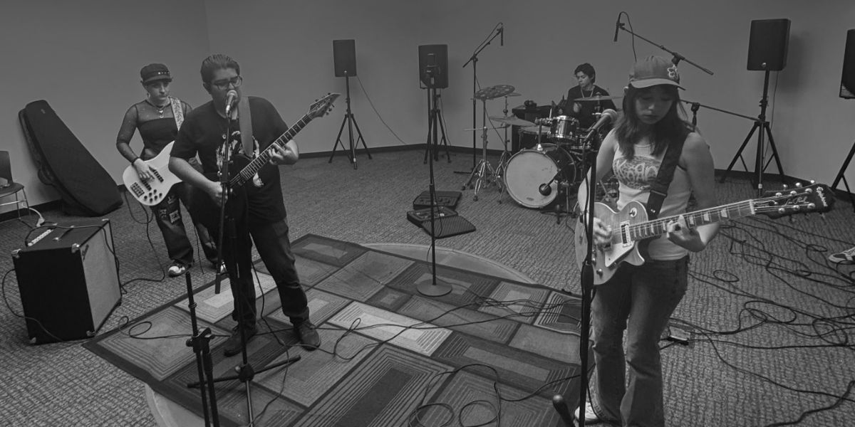 Venue recording: laptop and interface at outdoor covered patio concert space.